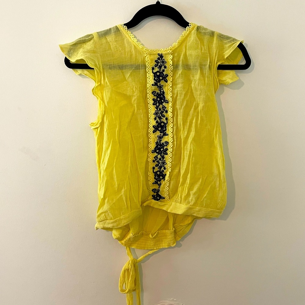 Yellow blouse with blue embroidery